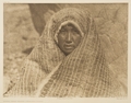 Nootka woman wearing cedar-bark blanket